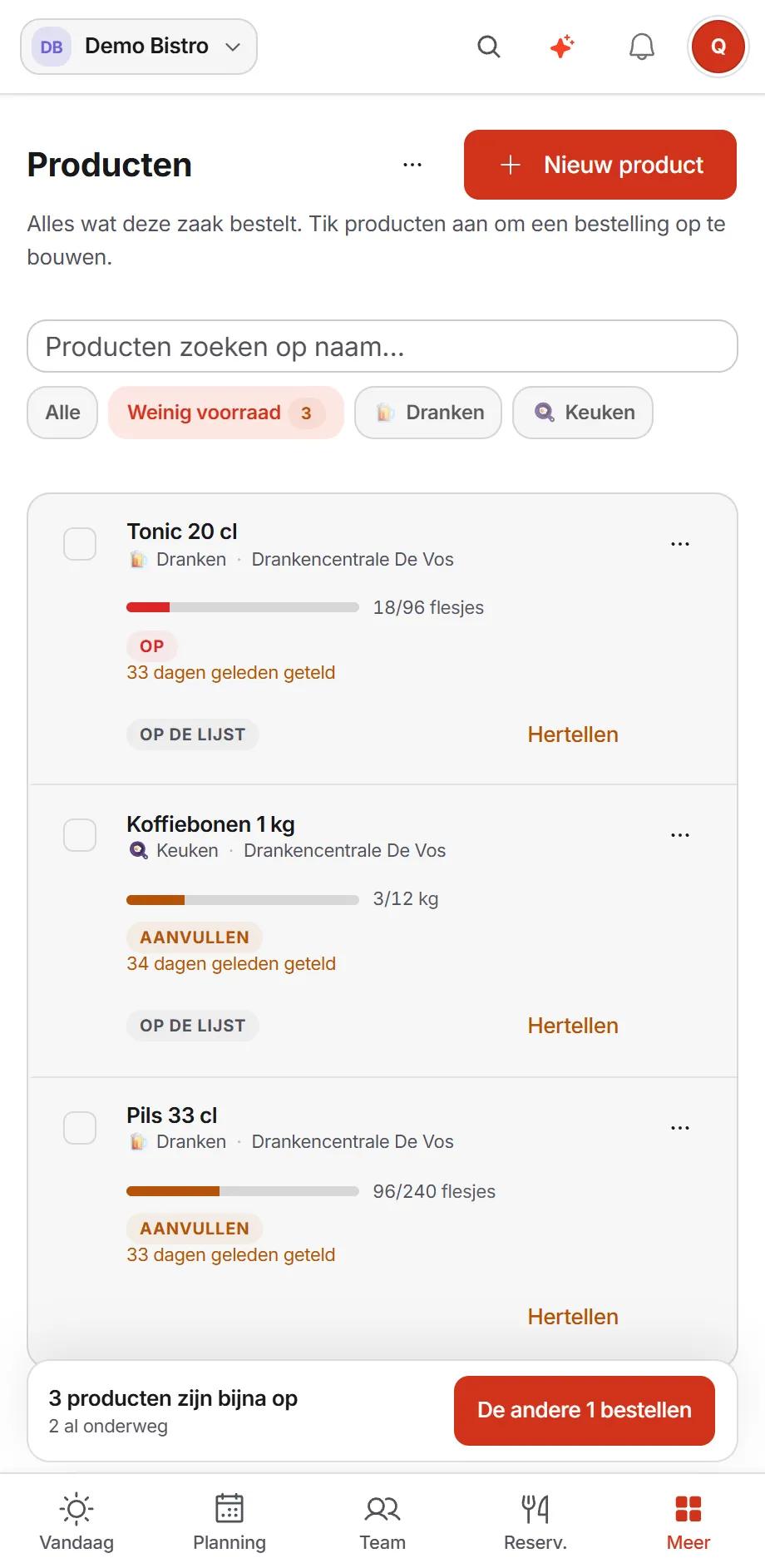 The product catalogue on a phone, filtered to low stock: tonic, coffee beans and lager, each with a bar comparing what is on the shelf with the full level, and a button at the bottom to order the rest